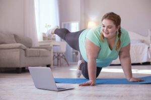 Woman working out with virtual trainer